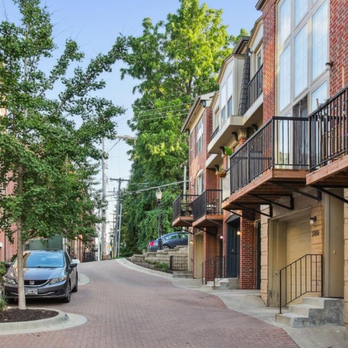a street with cars and buildings